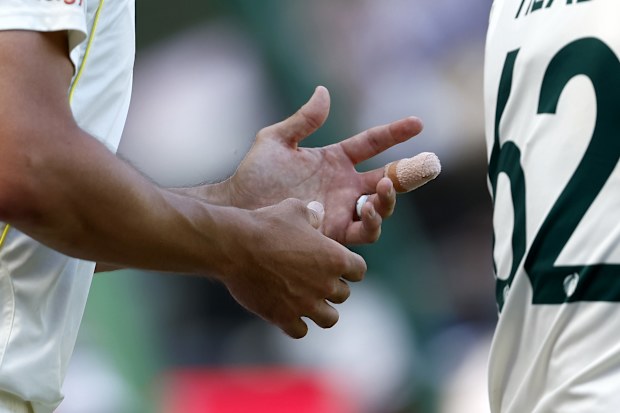 Mitchell Starc of Australia is seen with his middle finger taped up at the MCG. (Photo by Darrian Traynor/Getty Images)