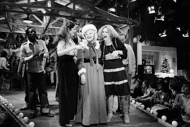 Miskel Spillman is seen on stage at "Saturday Night Live" on December 17, 1977, following her debut as host. Spillman, a then-80-year-old grandmother from New Orleans, won a contest that put her on one of television's biggest stages. She's pictured with Garrett Morris, Gilda Radner and granddaughter, Janine Baker.