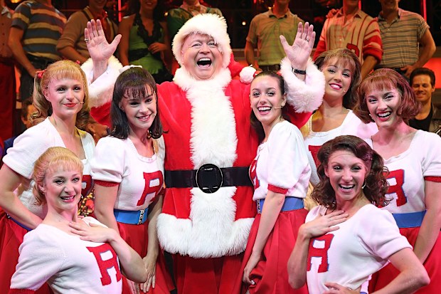 Bert Newton as Santa Claus with the cast of Grease at The Regent Theatre on December 11, 2014 in Melbourne, Australia.