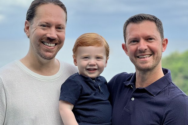 Ben Harris and Danny Cowan with their son Lachlan in the Philippines.