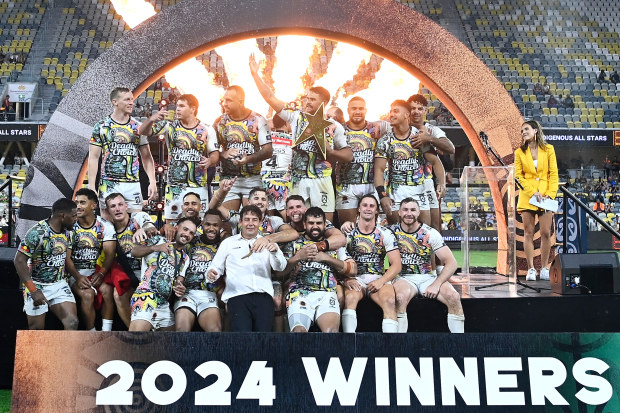The Indigenous men celebrate victory over the Maori men in the NRL All Stars match.