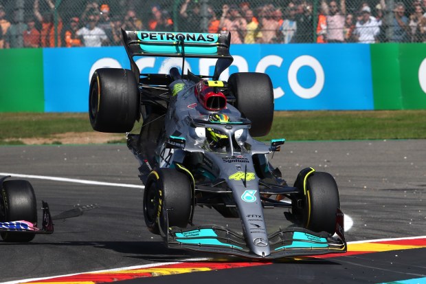 Lewis Hamilton's car is flung into the air after wheel-to-wheel contact with Fernando Alonso on lap one of the Belgian Grand Prix.