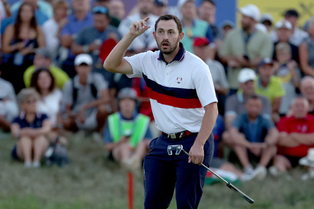Patrick Cantlay of Team United States pretends to tip his cap in celebration at the Ryder Cup.