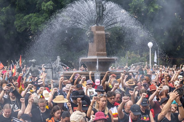 People observe a minute of silence for Sophie Quinn, Nerida Quinn, and John Harris, who were fatally shot at Lake Cargelligo on Thursday, at the Invasion Day rally in Hyde Park. Monday 26th January 2026. Photo: Sitthixay Ditthavong
