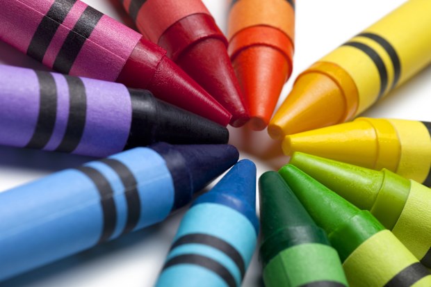 colorful crayon tips pointing towards each other.