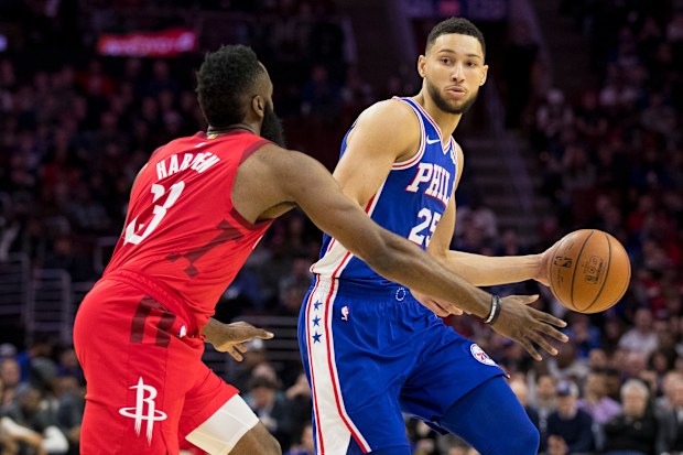 Ben Simmons dribbles the ball against James Harden.