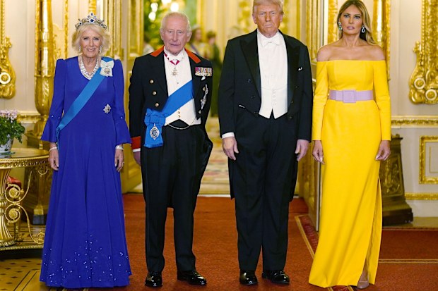 Britain's King Charles III, centre left, and U.S. President Donald Trump, centre right, pose with Queen Camilla and First Lady Melania Trump, right, at the state banquet at Windsor Castle, England, on day one of the president's second state visit to the UK, Wednesday Sept. 17, 2025. (Aaron Chown/PA via AP, Pool)