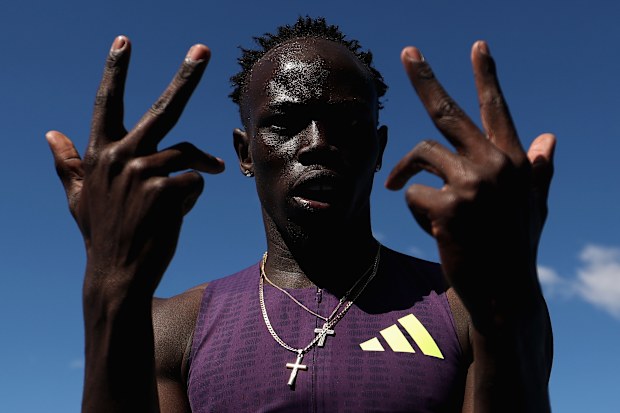 SYDNEY, AUSTRALIA - APRIL 12: Gout Gout of Queensland celebrates after breaking the World Junior Record and Australian Record and a PB to win the Men's 200m final in 19.67 seconds during the 2026 Australian Athletics Championships at Sydney Olympic Park Athletic Centre on April 12, 2026 in Sydney, Australia. (Photo by Cameron Spencer/Getty Images)