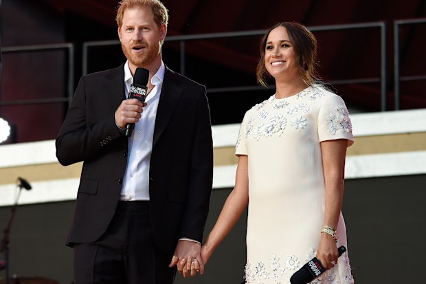 Prince Harry, the Duke of Sussex, left, and Meghan, the Duchess of Sussex speak at Global Citizen Live in Central Park on Saturday, Sept. 25, 2021, in New York. (Photo by Evan Agostini/Invision/AP)