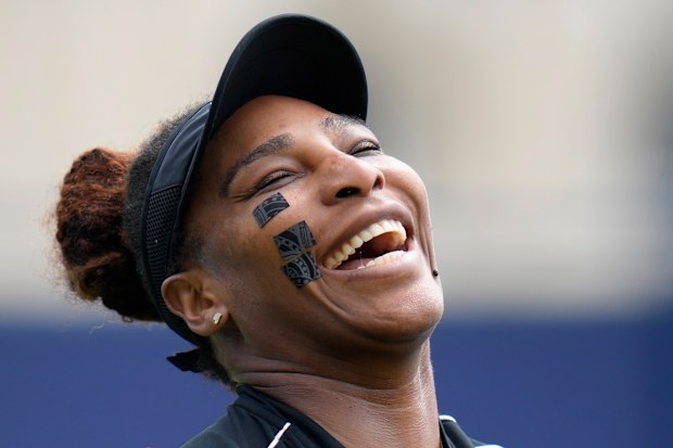 Serena Williams of the United States laughs during a practice session at the Eastbourne International tennis tournament in Eastbourne, England, Tuesday, June 21, 2022. Serena Williams will play a doubles match with partner Ons Jabeur of Tunisia at the tournament later Tuesday. (AP Photo/Kirsty Wigglesworth)