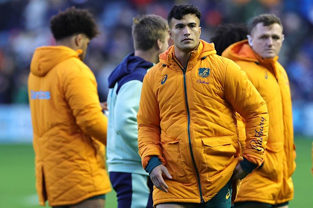 Joseph-Aukuso Suaalii of Australia looks dejected.