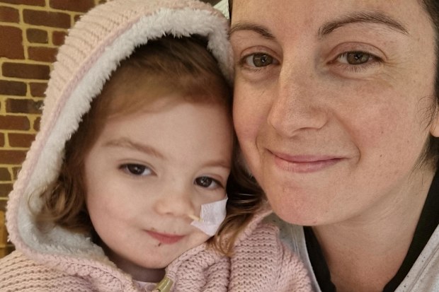 Izzy with her mum Amy after being diagnosed with cancer.