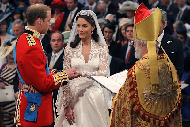 Britain's Prince William and Kate Middleton exchange rings in front of the Archbishop of Canterbury at Westminster Abbey, London, Friday April 29, 2011. 