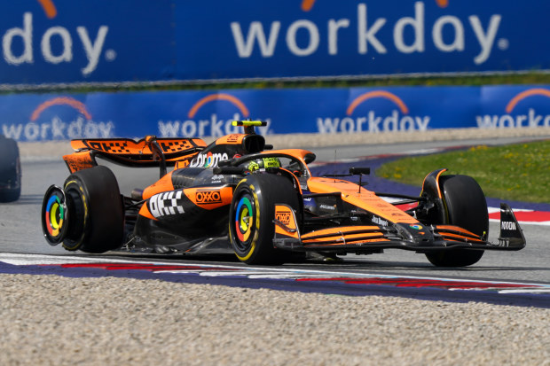 Lando Norris of the UK is driving the (4) McLaren F1 Team MCL38 Mercedes with a damaged tyre after contact with Max Verstappen of the Netherlands, who is driving the (1) Oracle Red Bull Racing RB20 Honda RBPT during the Formula 1 Qatar Airways Austrian Grand Prix in Spielberg, Austria, on June 30, 2024. (Photo by Alessio Morgese/NurPhoto)