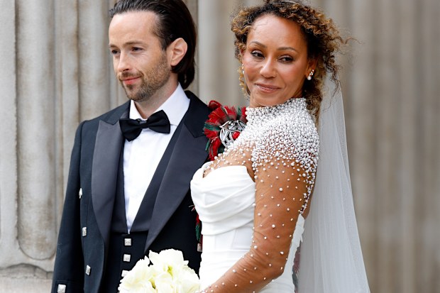 Rory McPhee and Mel B depart following their wedding in the OBE (Order of the British Empire) Chapel at St Paul's Cathedral on July 5, 2025 in  London, England. 