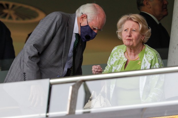 Former Prime Minister John Howard and his wife Janette, prepare to watch play after a rain delay on day one of the third cricket test between India and Australia at the Sydney Cricket Ground, Sydney, Australia, January 7, 2021. 