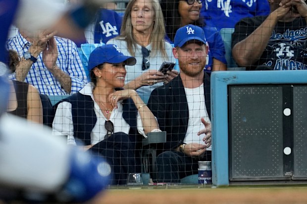 Prince Harry and Meghan Markle, the Duke and Duchess of Sussex, at Game 4 of baseball's World Series between the Los Angeles Dodgers and the Toronto Blue Jays in Los Angeles, Tuesday, Oct. 28, 2025. 