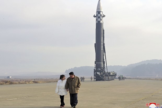 North Korea has unveiled the little-known daughter of its leader Kim Jong Un at a missile launch site.
