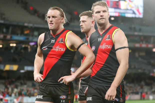 Mason Redman and Jake Stringer of the Bombers look dejected after a loss.