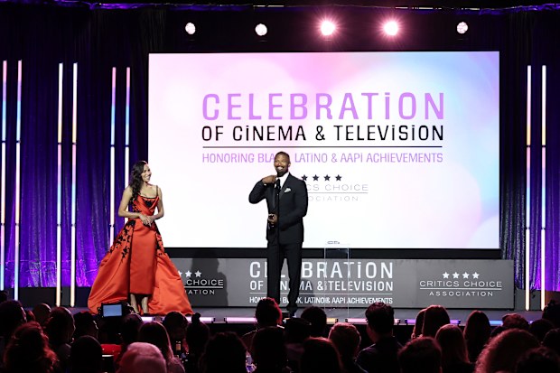 Jurnee Smollett (L) presents the "Vanguard Award" to Jaime Foxx (R)
