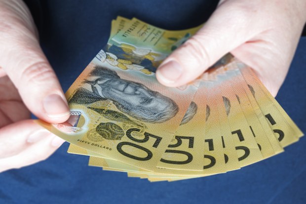 close up person holding cash