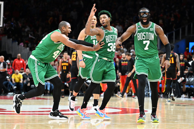 ATLANTA, GA - JANUARY 1: Marcus Smart #36 of the Boston Celtics celebrates a play during the game against the Atlanta Hawks during Round 1 Game 6 of the 2023 NBA Playoffs on January 1, 2023 at State Farm Arena in Atlanta, Georgia.  NOTE TO USER: User expressly acknowledges and agrees that, by downloading and/or using this Photograph, user is consenting to the terms and conditions of the Getty Images License Agreement. Mandatory Copyright Notice: Copyright 2023 NBAE (Photo by Adam Hagy/NBAE via G