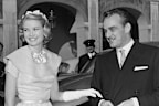 Prince Rainier of Monaco and his wife-to-be Princess Grace (1929 - 1982) greet well-wishers in the palace courtyard in Monte Carlo prior to their wedding, 18th April 1956. (Photo by Reg Burkett/Keystone/Hulton Archive/Getty Images)