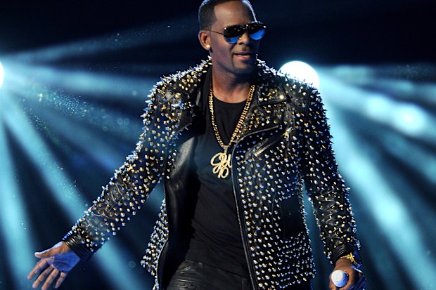 FILE - In this June 30, 2013 file photo, R. Kelly performs at the BET Awards in Los Angeles. Kelly sings about his troubles and battles in a new 19-minute song, addressing sexual abuse claims against him that remerged and put a screeching halt on his career. The song, âI Admit ,â was posted to Soundcloud on Monday, July 23, 2018. 