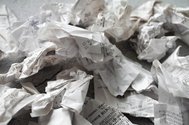 Close-up of many crumpled receipts from stores. The concept of shopping and purchases.
