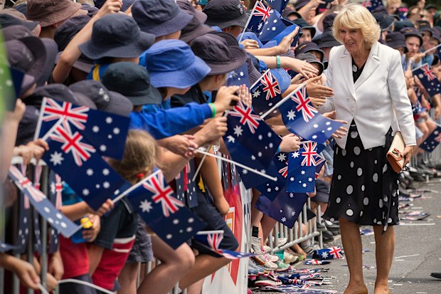 Camilla, Duchess of Cornwall, is greeted by flag-waving children in Tanunda, in the Barossa Valley area of Australia, Tuesday, Nov. 10, 2015.