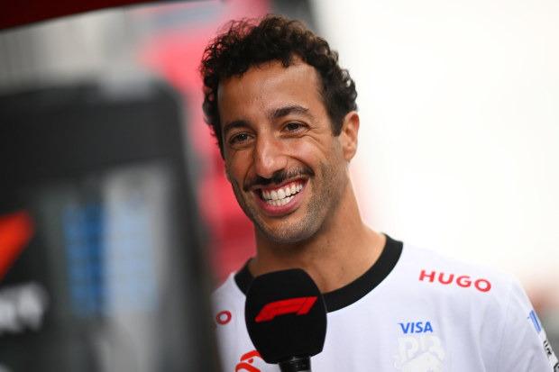 Daniel Ricciardo of RB talks to the media in the Paddock during previews ahead of the Spanish Grand Prix.