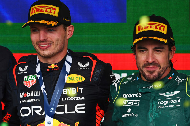 Three-time F1 champion Max Verstappen (left) with two-time champ Fernando Alonso.