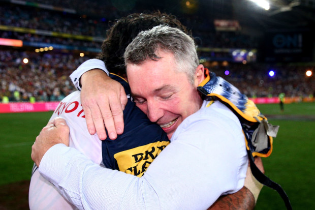 Paul Green and Johnathan Thurston embrace after winning the 2015 premiership with the Cowboys.