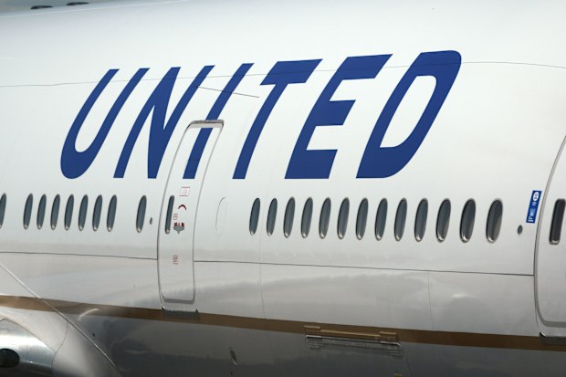 A United Airlines Boeing 777 passenger aircraft at Denver International Airport