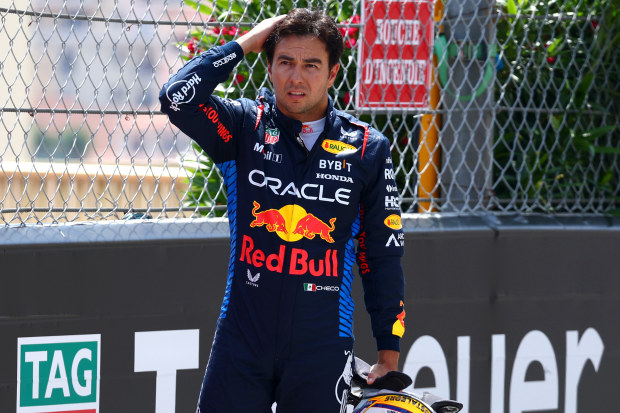 Sergio Perez looks on after crashing at the start during the Monaco Grand Prix.
