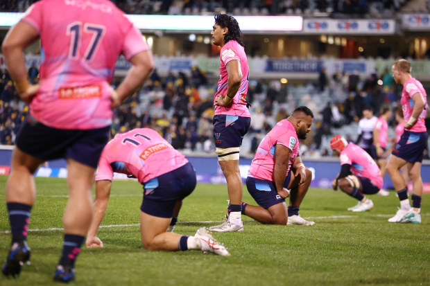 Rebels players look dejected during the round 14 Super Rugby Pacific match between ACT Brumbies and Melbourne Rebels.