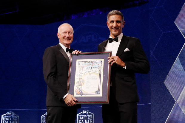 AFL chairman Richard Goyder, and Hall of Fame inductee Matthew Pavlich pose for a photo during the 2022 Australian Football Hall of Fame dinner. 