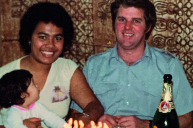Silva and Ken at home in Australia with one of their daughters.