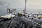 A car is halted at the edge of the Sunshine Skyway Bridge across Tampa Bay, Fla., after the freighter Summit Venture struck the bridge during a thunderstorm and tore away a large part of the span, May 9 1980.