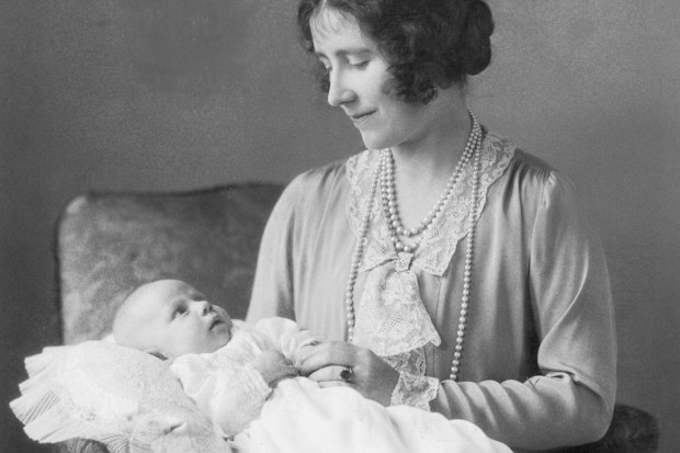 Elizabeth, the Queen Mother, holding her younger daughter Margaret Rose (1930 - 2002). 