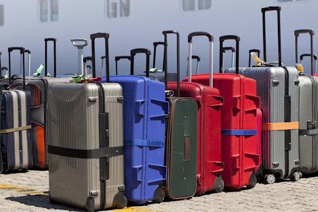 Straps can make your suitcase stand out- but also stop it spilling if the zip breaks.