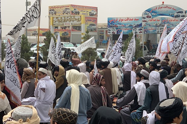 KANDAHAR, AFGHANISTAN - AUGUST 15: Participants are on their motorbikes holding flags during a demonstration held by the Taliban and their followers in support of the second anniversary of the Taliban rule in Kandahar, Afghanistan on August 15, 2023. (Photo by Mohammad Noori/Anadolu Agency via Getty Images)