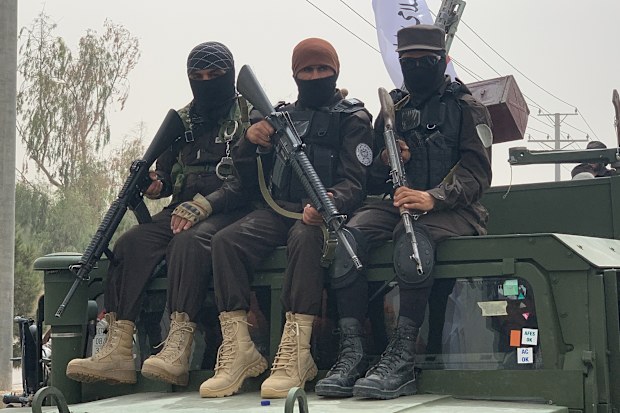 KANDAHAR, AFGHANISTAN - AUGUST 15: Armed participants sit on a military vehicle during a demonstration held by the Taliban and their followers in support of the second anniversary of the Taliban rule in Kandahar, Afghanistan on August 15, 2023. (Photo by Mohammad Noori/Anadolu Agency via Getty Images)
