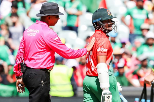 Shakib Al Hasan of Bangladesh is instructed by the umpire to leave the oval after being found out LBW for a duck bowled by Shadab Khan of Pakistan.