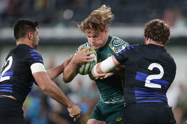 Michael Hooper of the Wallabies Is tackled by Julian Montoya of the Pumas.