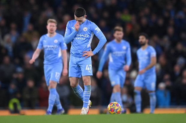 Phil Foden of Manchester City is dejected after their side conceded.