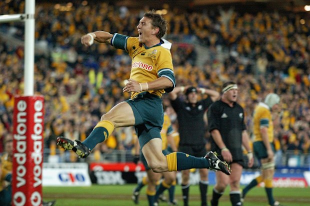 Mat Rogers of the Wallabies celebrates scoring a try in 2002.