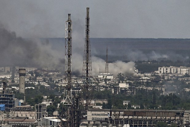Black smoke and dirt rise from the nearby city of Severodonetsk during battle between Russian and Ukrainian troops in the eastern Ukraine region of Donbas. 