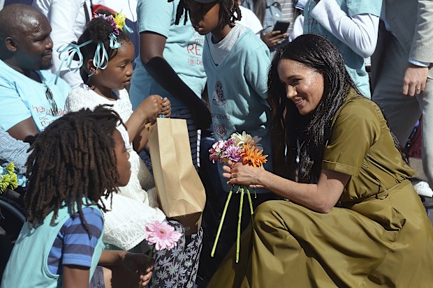 Prince Harry, and his wife, Meghan, the Duchess of Sussex, during a walkabout in Bo-Kaap, a heritage site, in Cape Town, South Africa, Tuesday, Sept, 24, 2019.  