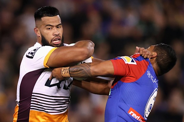 Payne Haas of the Broncos is tackled.